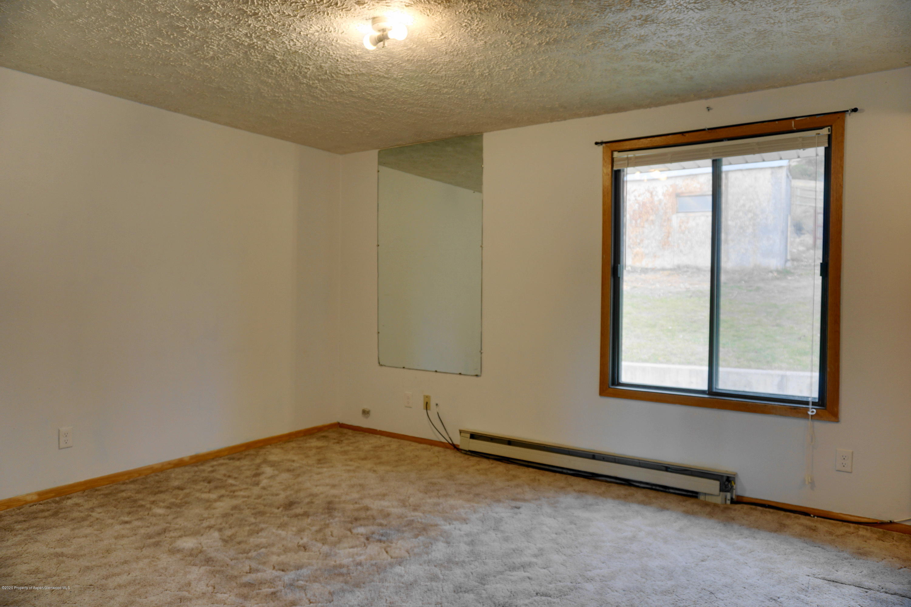 1409 Silver Sage Road Meeker, CO 81641 - Photo 16 of 26 an empty room with a window