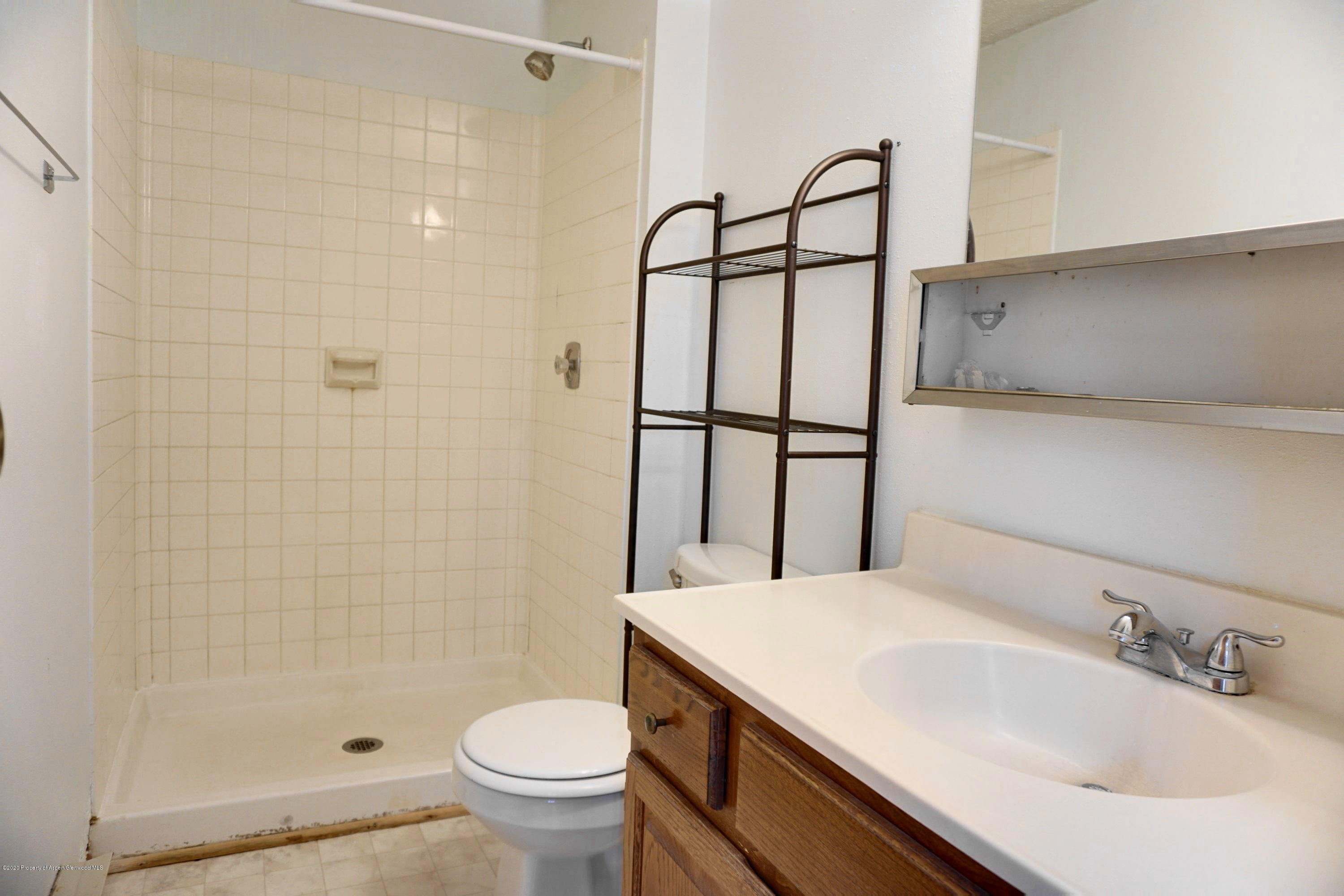1409 Silver Sage Road Meeker, CO 81641 - Photo 18 of 26 a bathroom with a sink toilet and shower