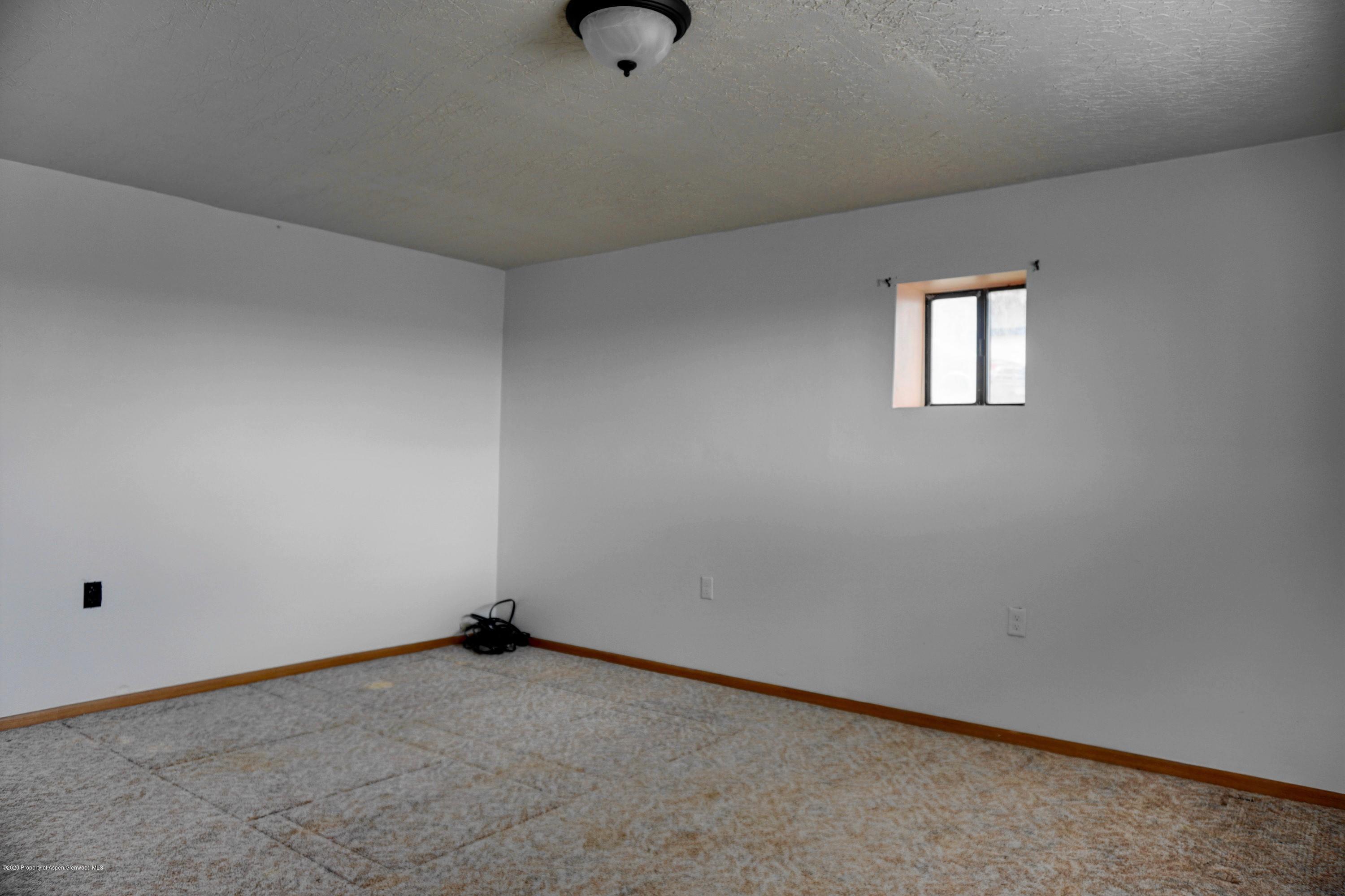 1409 Silver Sage Road Meeker, CO 81641 - Photo 20 of 26 an empty room with a workbench