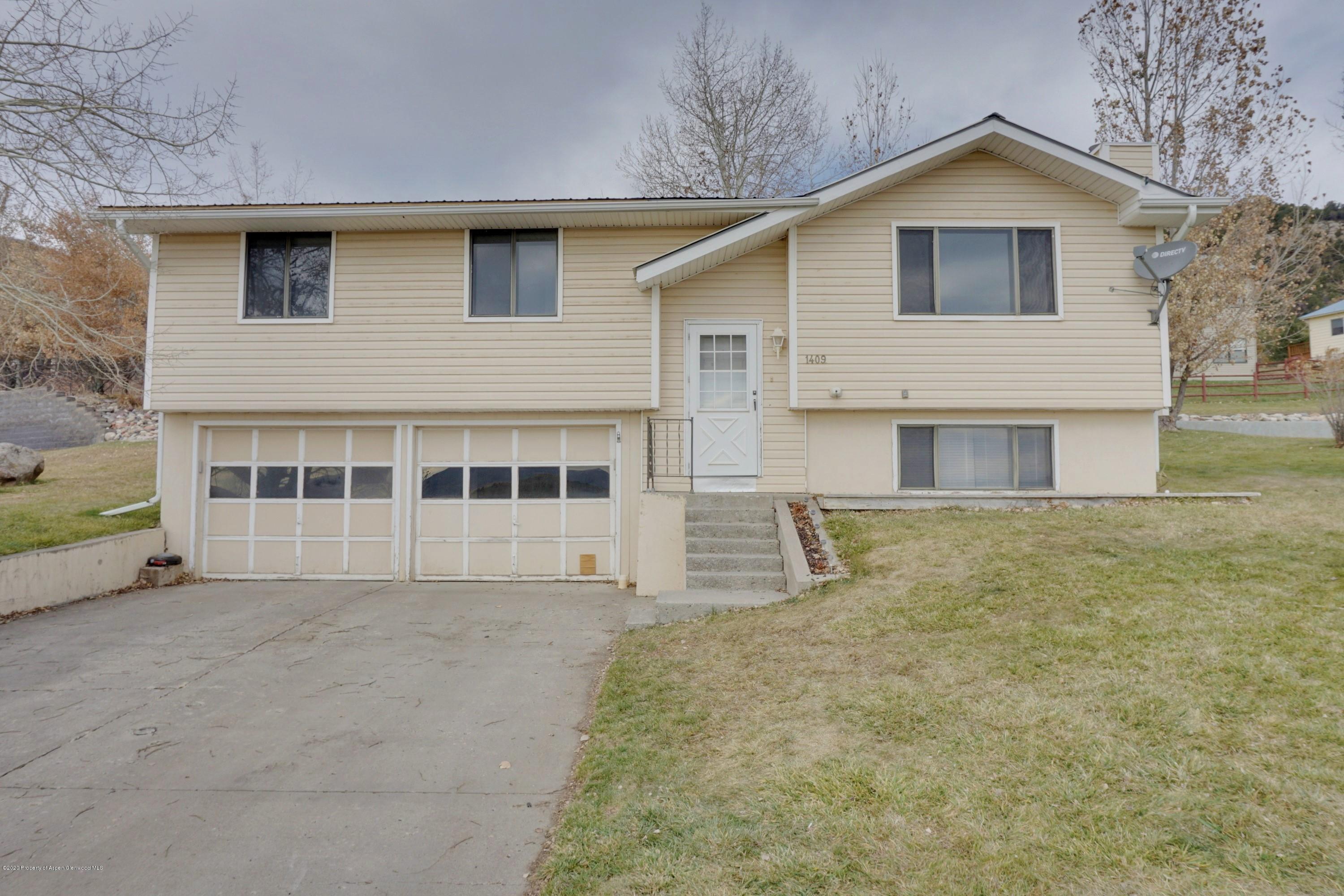 1409 Silver Sage Road Meeker, CO 81641 - Photo 23 of 26 a house with trees in the background
