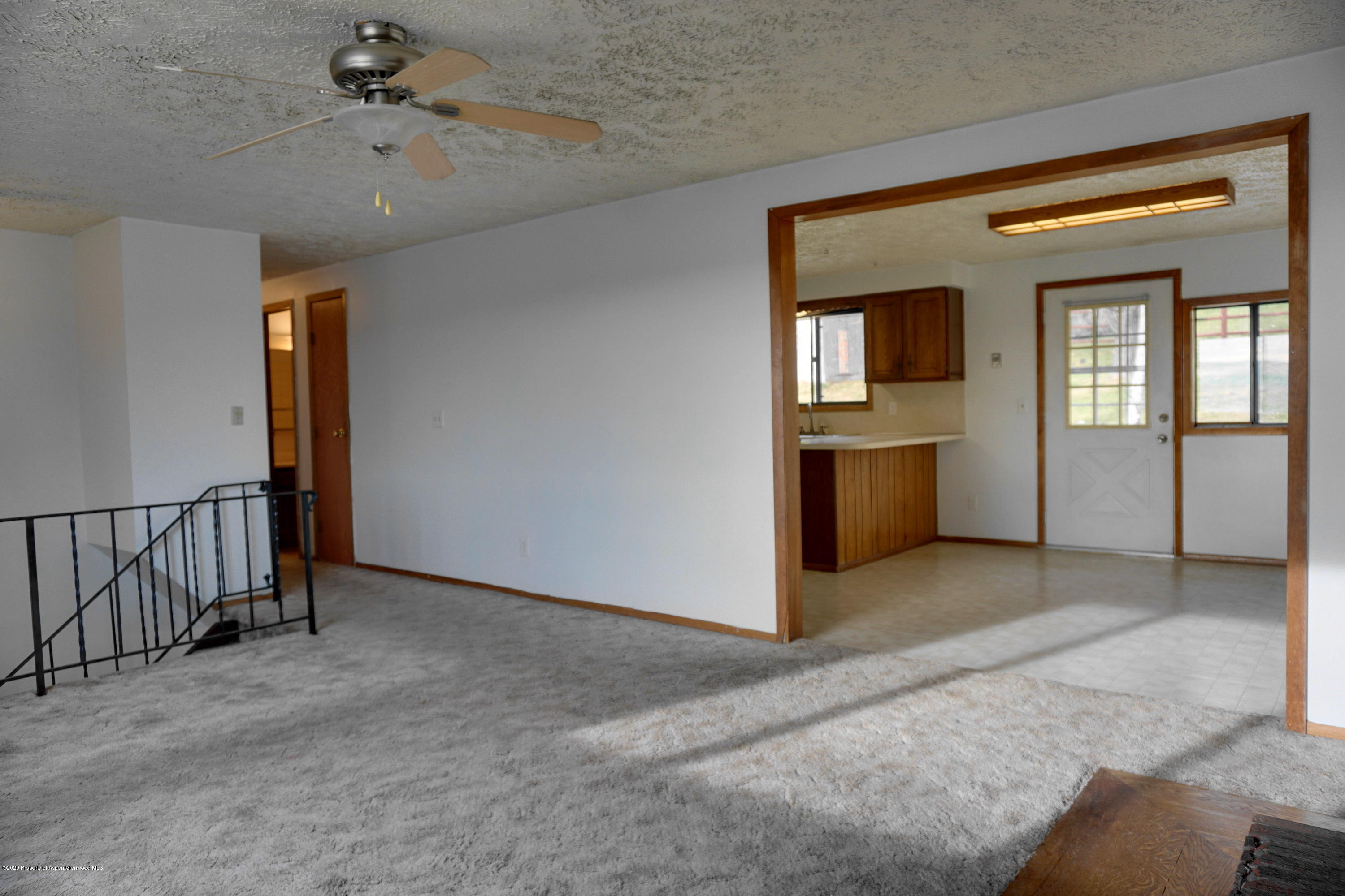 1409 Silver Sage Road Meeker, CO 81641 - Photo 4 of 26 a view of a livingroom with a staircase
