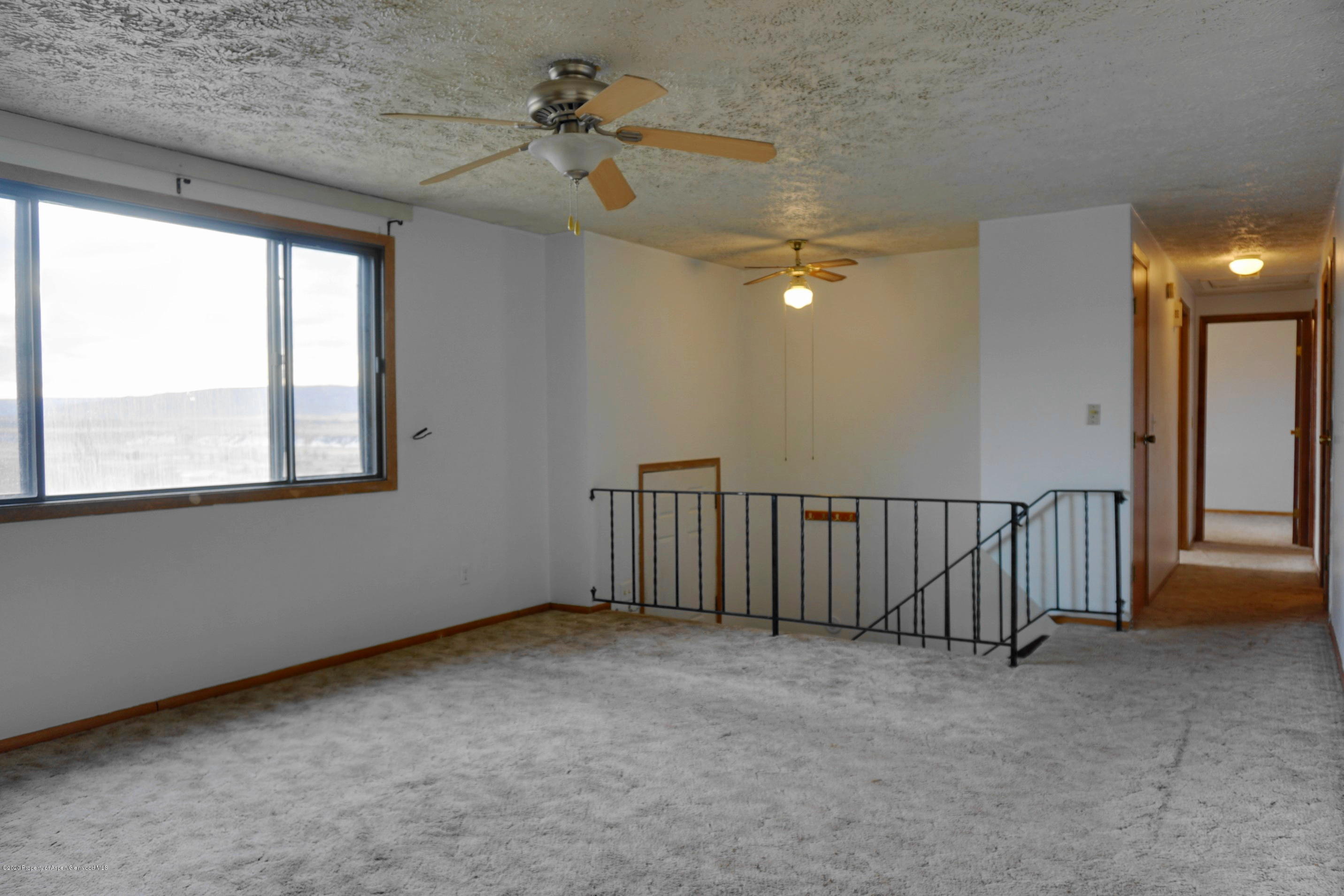 1409 Silver Sage Road Meeker, CO 81641 - Photo 5 of 26 a view of an empty room with a window
