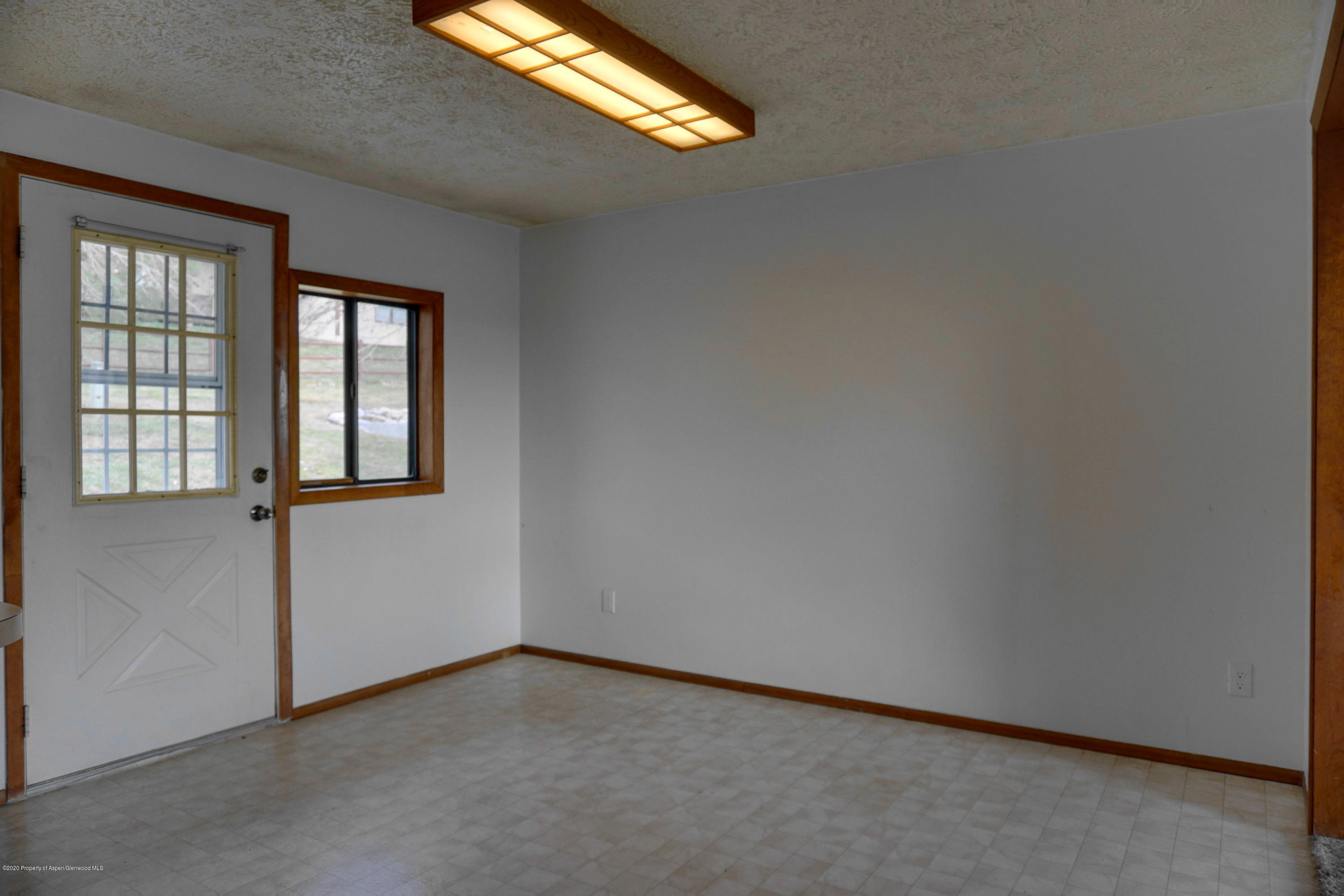 1409 Silver Sage Road Meeker, CO 81641 - Photo 9 of 26 an empty room with windows