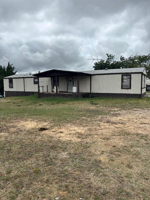260 Wonder Drive Springtown, TX 76082 - Photo 3 of 9 a backyard of a house with lots of green space