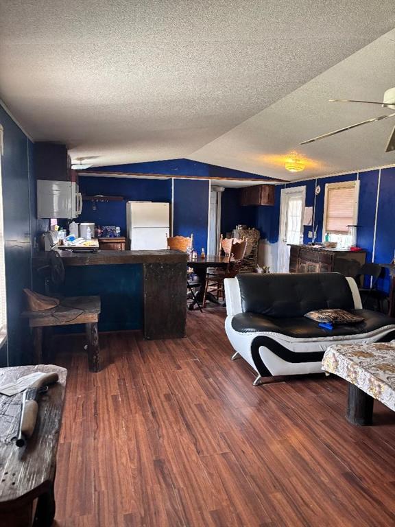 260 Wonder Drive Springtown, TX 76082 - Photo 4 of 9 a living room with furniture and a wooden floor
