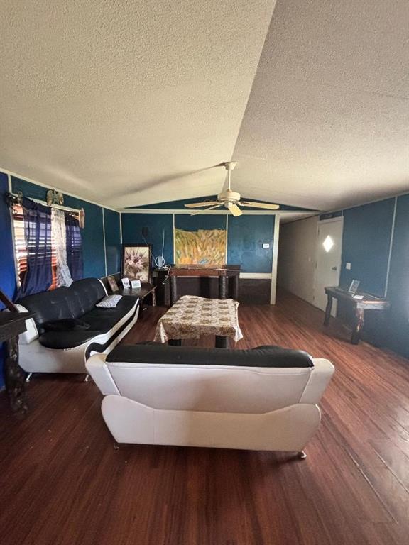 260 Wonder Drive Springtown, TX 76082 - Photo 5 of 9 a living room with furniture floor to ceiling window and wooden floor