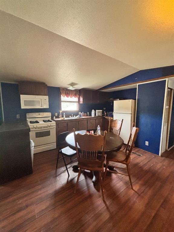 260 Wonder Drive Springtown, TX 76082 - Photo 6 of 9 a view of a dining room with furniture and wooden floor