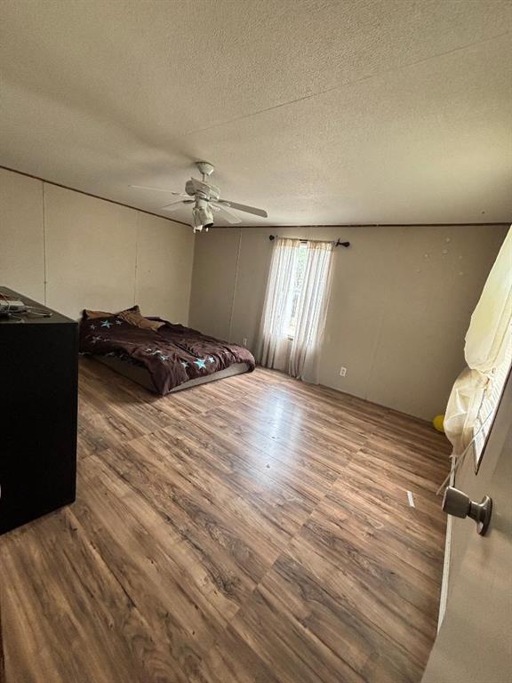 260 Wonder Drive Springtown, TX 76082 - Photo 9 of 9 a bedroom with a bed and a chair