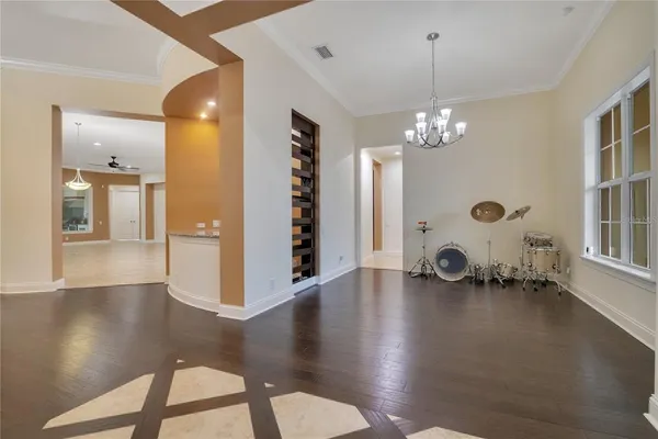 a view of a livingroom with furniture hardwood floor and a ceiling fan