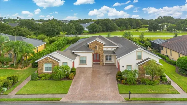 a view of a big yard in front of the house