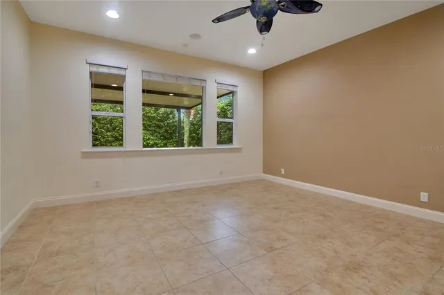 an empty room with a empty space and windows