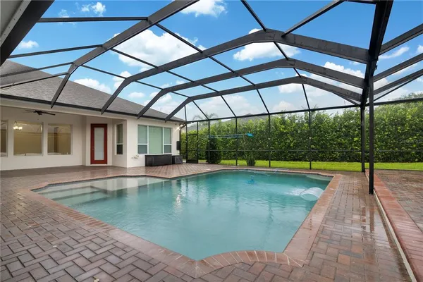 a view of swimming pool with a yard