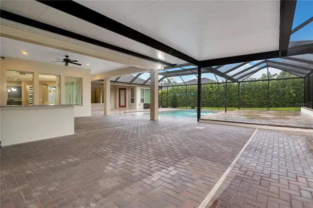 a view of a hall with a floor to ceiling window