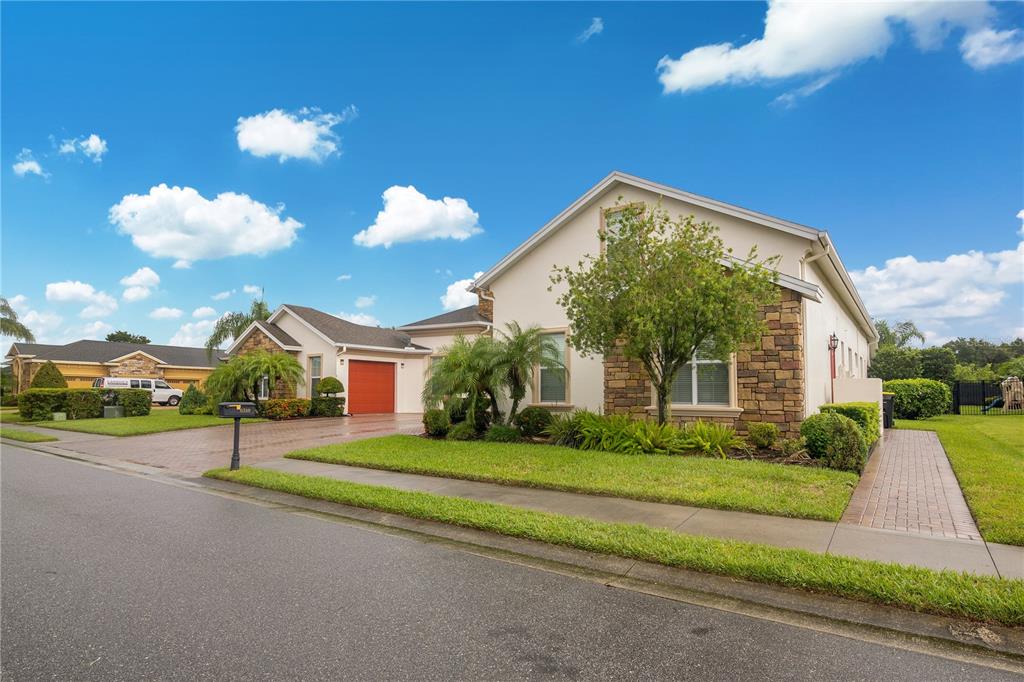 6510 Eagle Ridge Way Lakeland, FL 33813 - Photo 4 of 50 a view of a house with a big yard and large trees