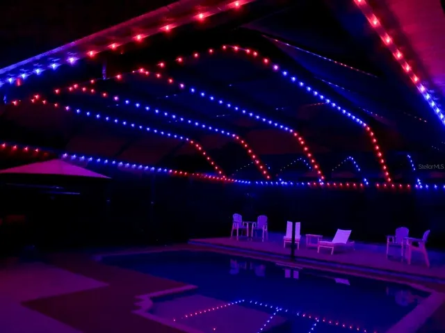 a view of swimming pool with outdoor seating