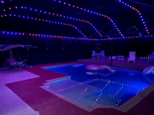 a view of a patio with swimming pool