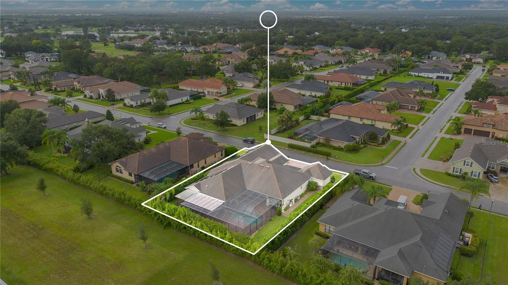 6510 Eagle Ridge Way Lakeland, FL 33813 - Photo 45 of 50 an aerial view of a house with a garden and lake view