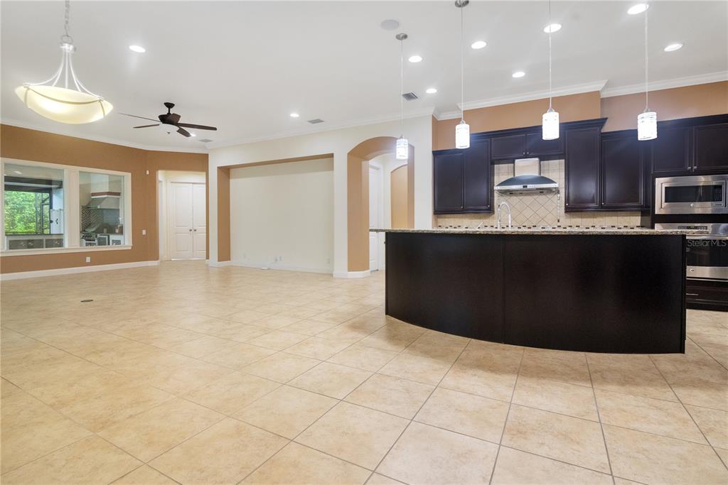 6510 Eagle Ridge Way Lakeland, FL 33813 - Photo 6 of 50 a large kitchen with stainless steel appliances granite countertop a refrigerator a sink and a stove