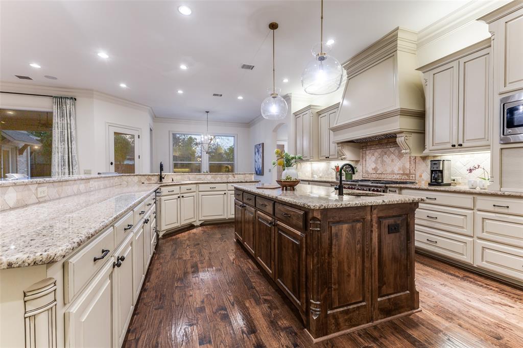 6031 Azalea Lane Dallas, TX 75230 - Photo 11 of 38 a kitchen with stainless steel appliances granite countertop a stove a sink dishwasher a refrigerator and a oven