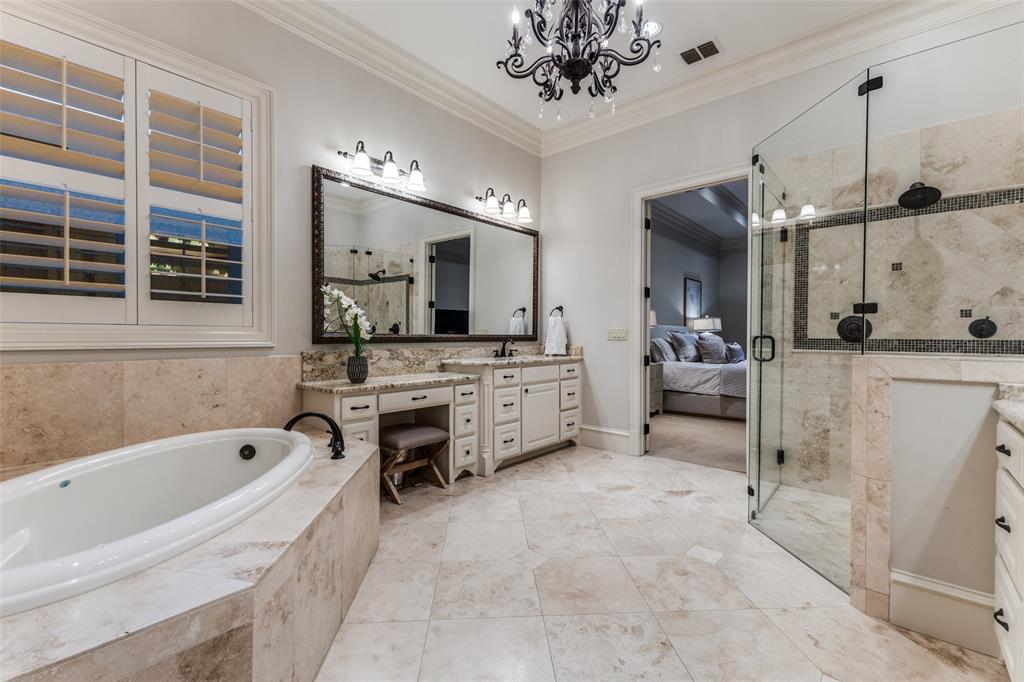 6031 Azalea Lane Dallas, TX 75230 - Photo 16 of 38 a bathroom with a tub sink and mirror