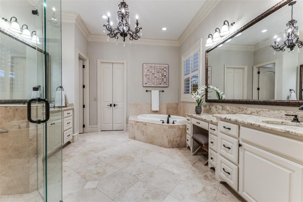 6031 Azalea Lane Dallas, TX 75230 - Photo 17 of 38 a spacious bathroom with a granite countertop tub sink and mirror