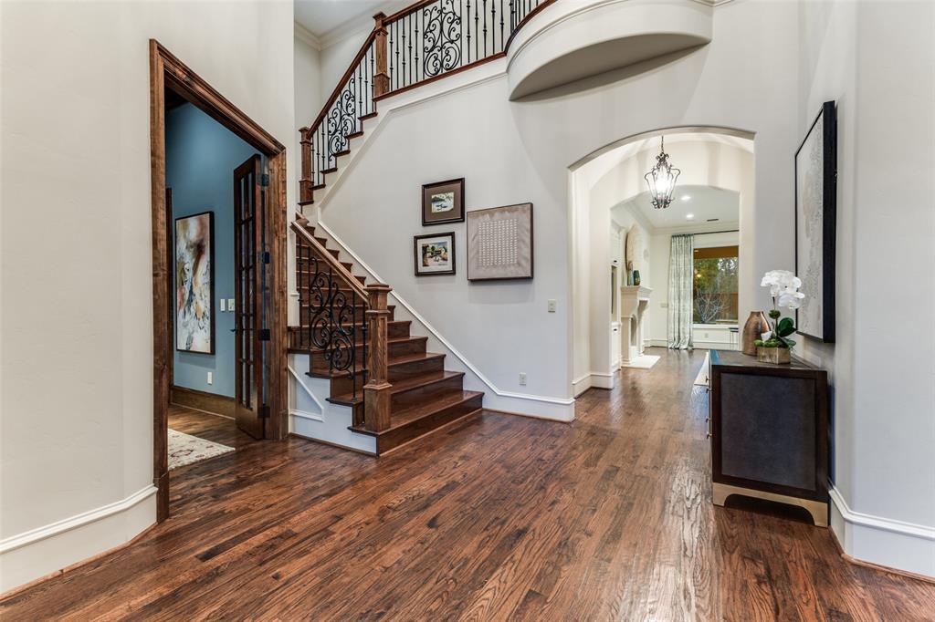 6031 Azalea Lane Dallas, TX 75230 - Photo 2 of 38 a view of a hallway with wooden floor and staircase