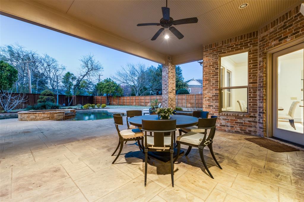 6031 Azalea Lane Dallas, TX 75230 - Photo 30 of 38 a dining room with furniture and a floor to ceiling window