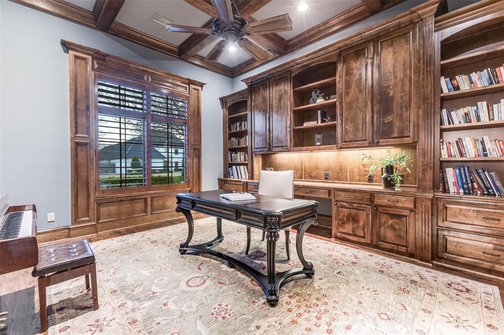 6031 Azalea Lane Dallas, TX 75230 - Photo 3 of 38 a work room with furniture a bookshelf and a window