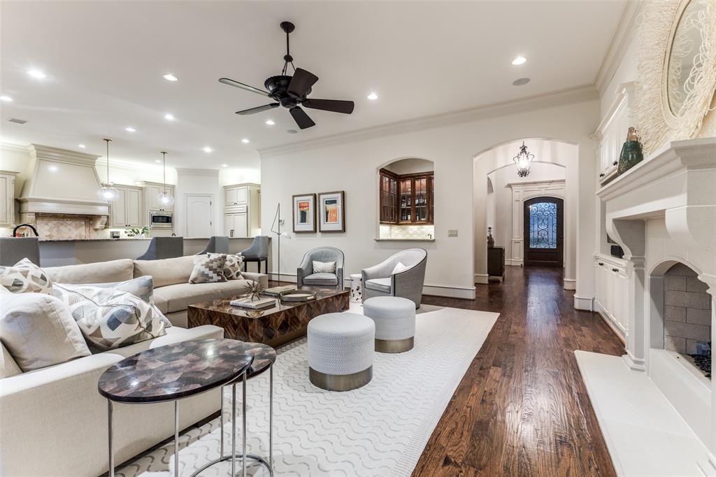 6031 Azalea Lane Dallas, TX 75230 - Photo 6 of 38 a living room with furniture kitchen view and a fireplace