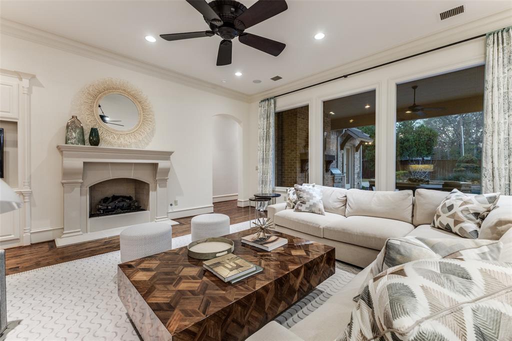 6031 Azalea Lane Dallas, TX 75230 - Photo 7 of 38 a living room with furniture and a fireplace