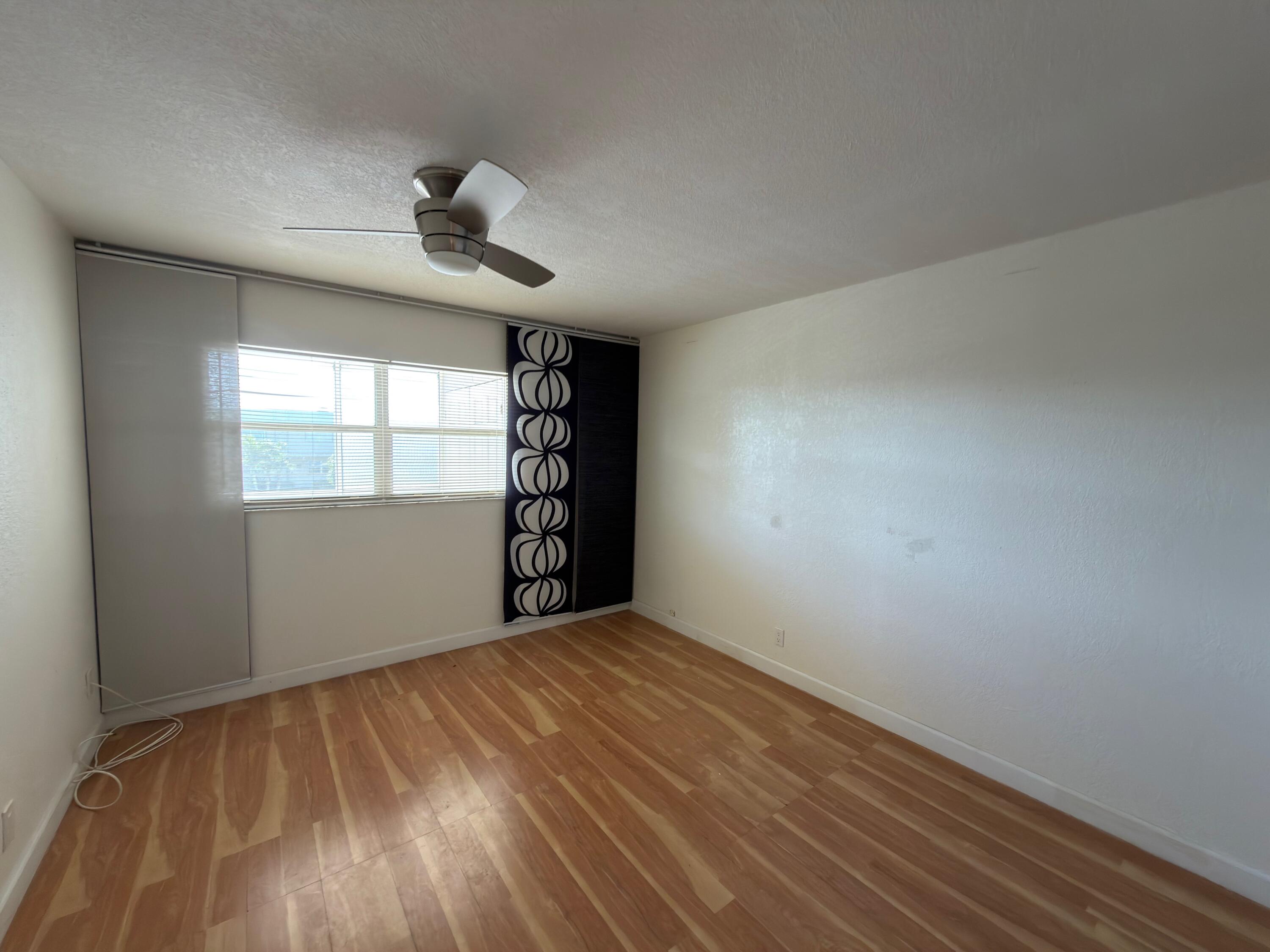 741 Monaco P, Unit 741 Delray Beach, FL 33446 - Photo 14 of 18 a view of an empty room with a window