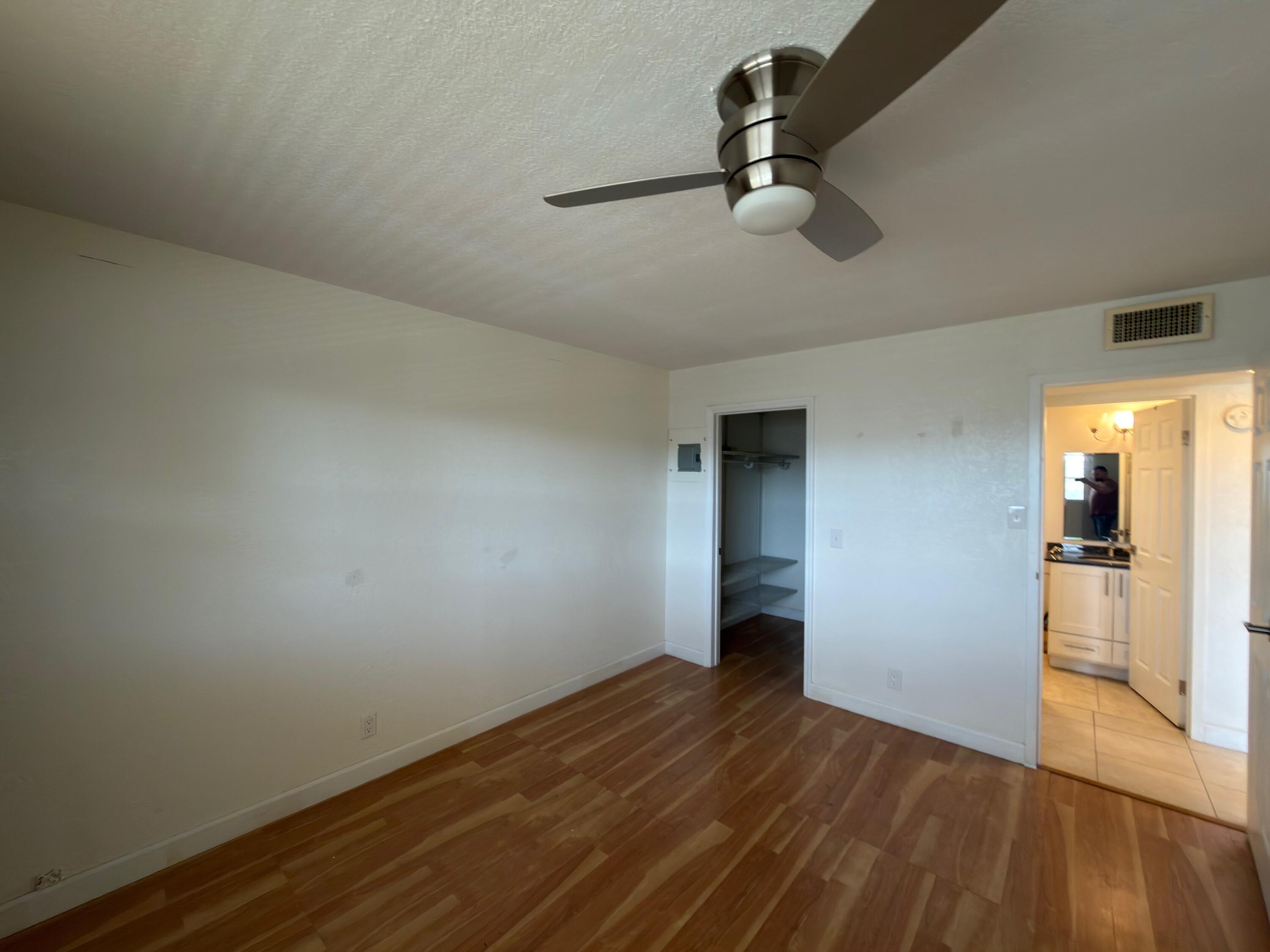 741 Monaco P, Unit 741 Delray Beach, FL 33446 - Photo 15 of 18 wooden floor in an empty room