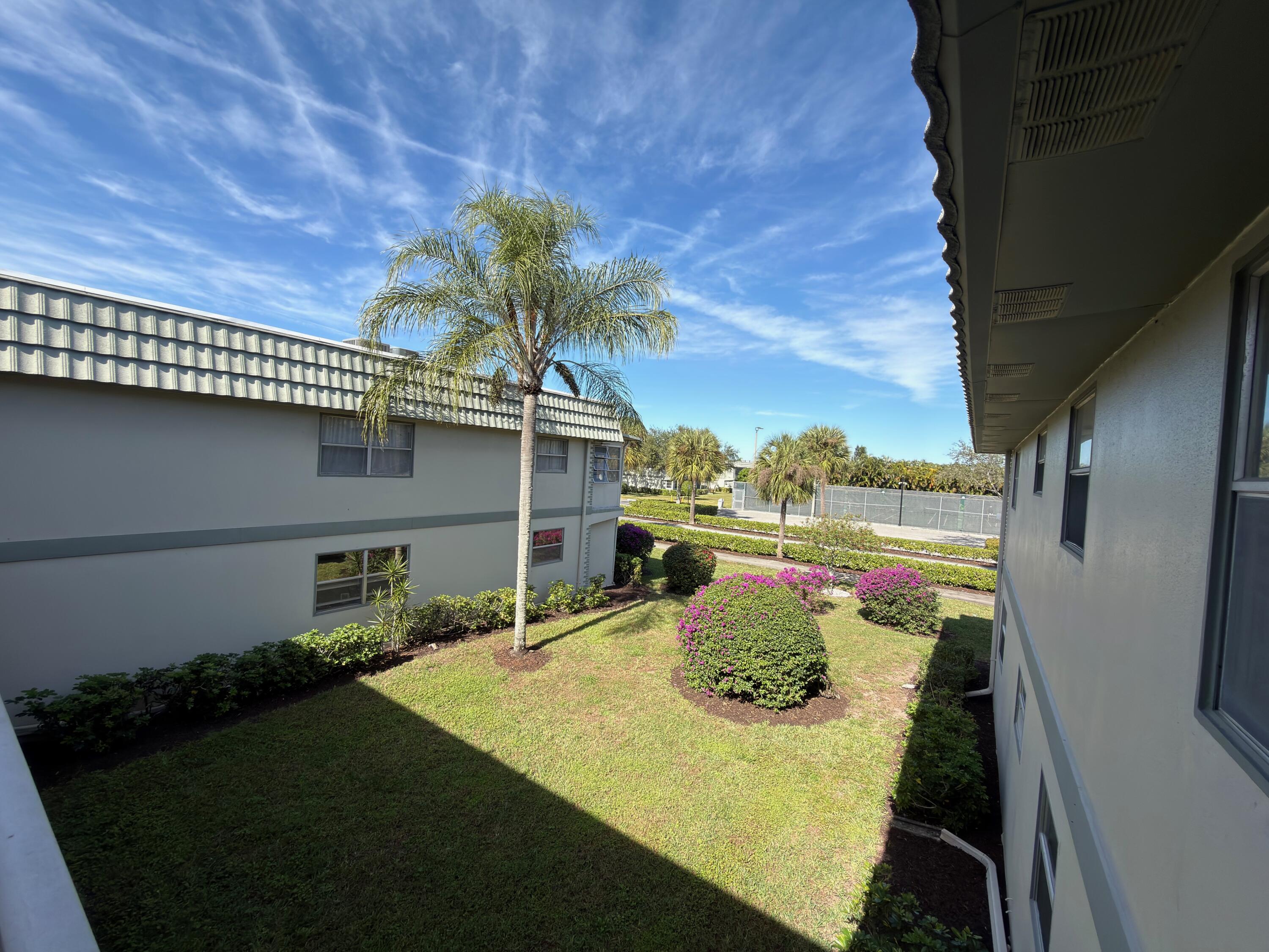 741 Monaco P, Unit 741 Delray Beach, FL 33446 - Photo 3 of 18 a view of swimming pool with a patio