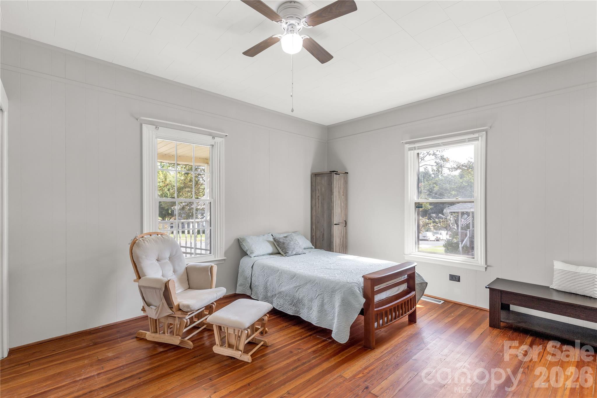 206 McConnell Street Clover, SC 29710 - Photo 16 of 31 a bedroom with a bed and wooden floor