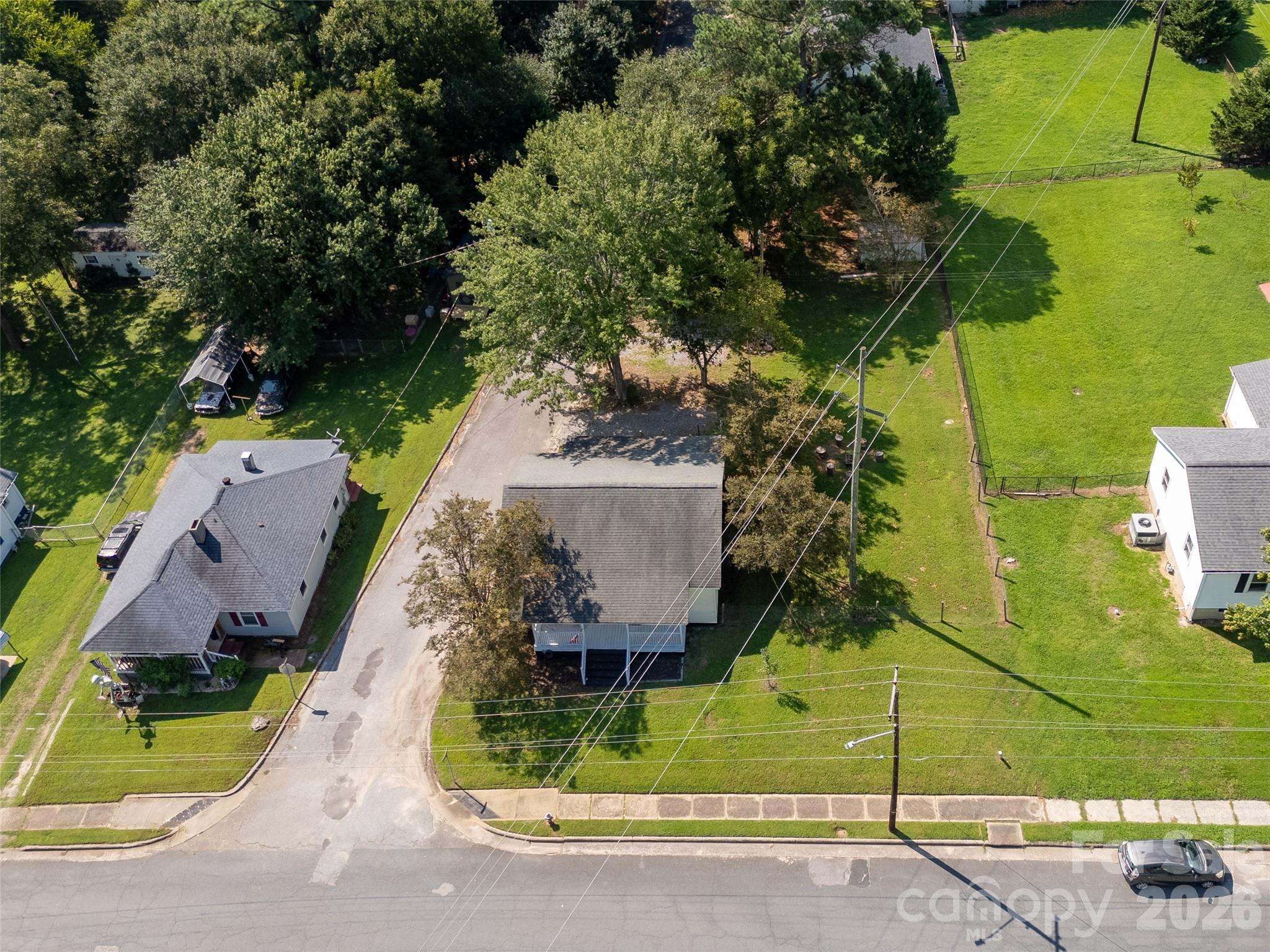 206 McConnell Street Clover, SC 29710 - Photo 23 of 31 an aerial view of a house with a yard basket ball court and outdoor seating