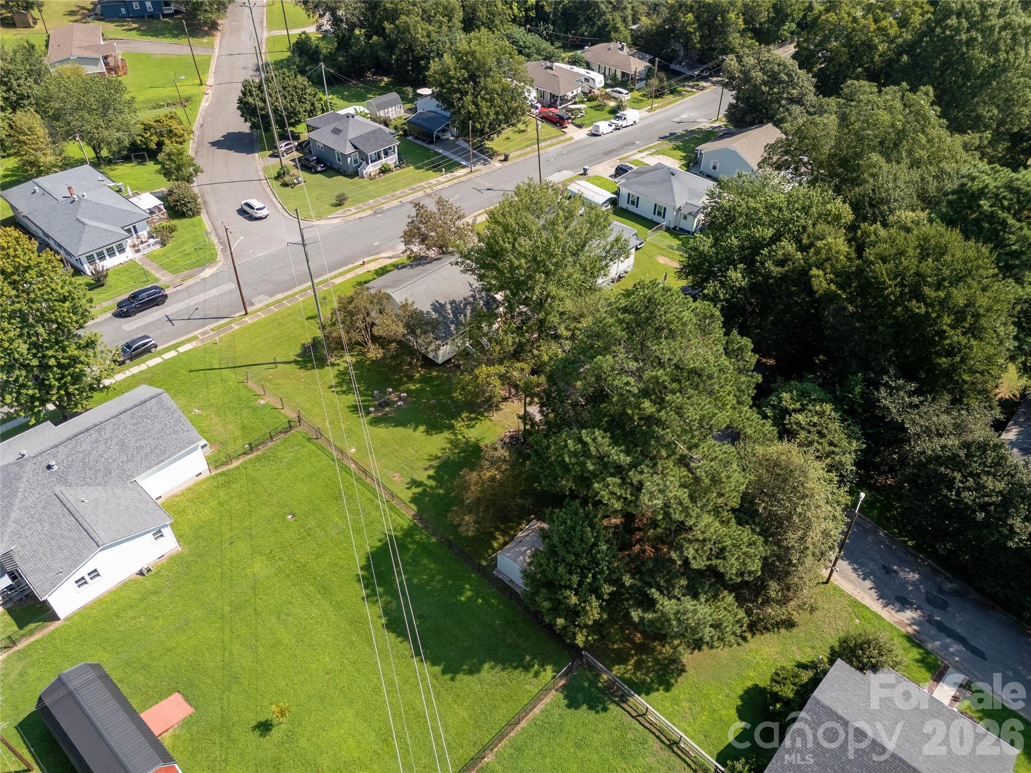 206 McConnell Street Clover, SC 29710 - Photo 26 of 31 an aerial view of residential house with outdoor space and trees all around