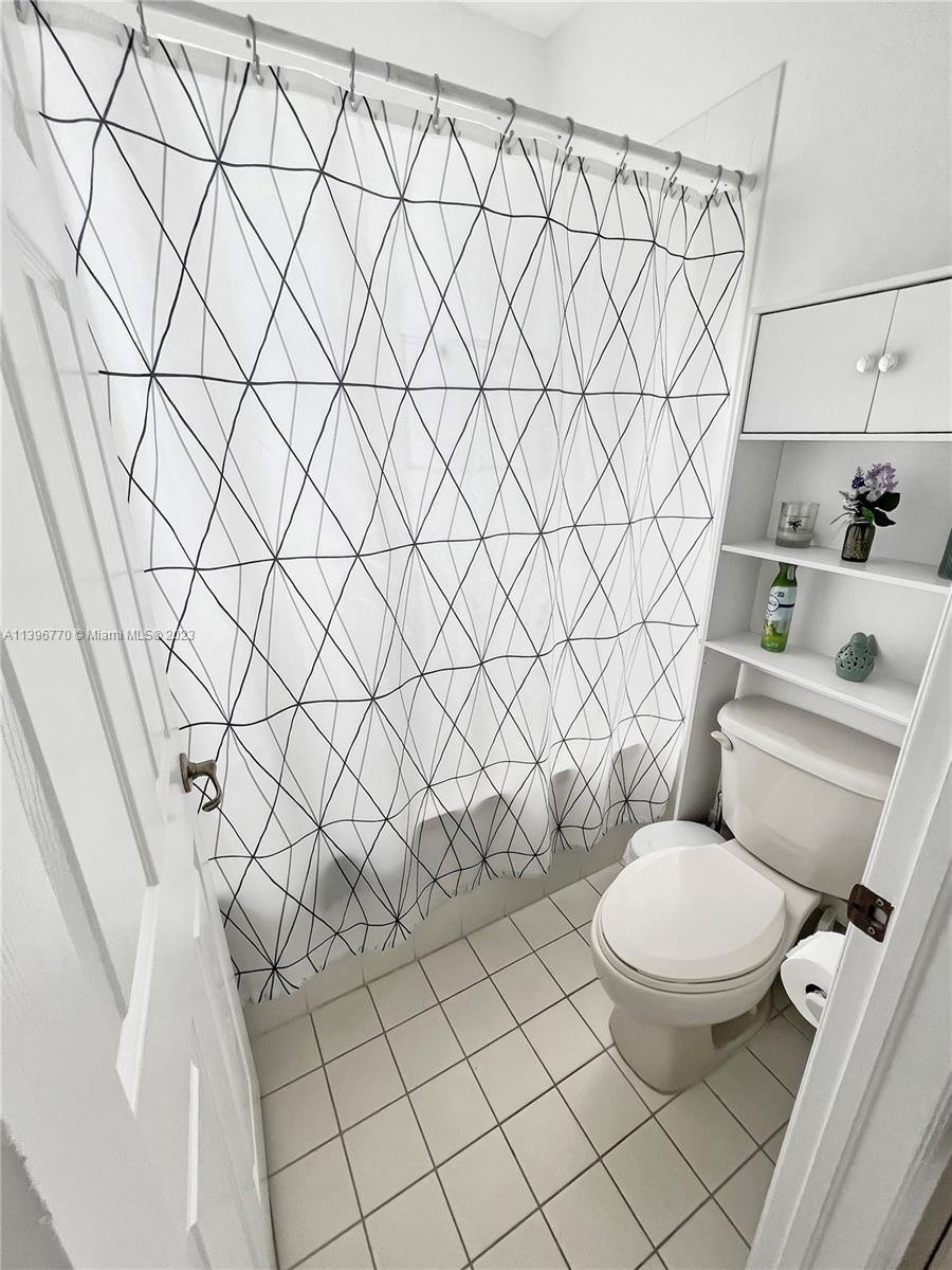 12524 Southwest 126th Avenue Miami, FL 33186 - Photo 16 of 23 a white toilet sitting next to a white wall