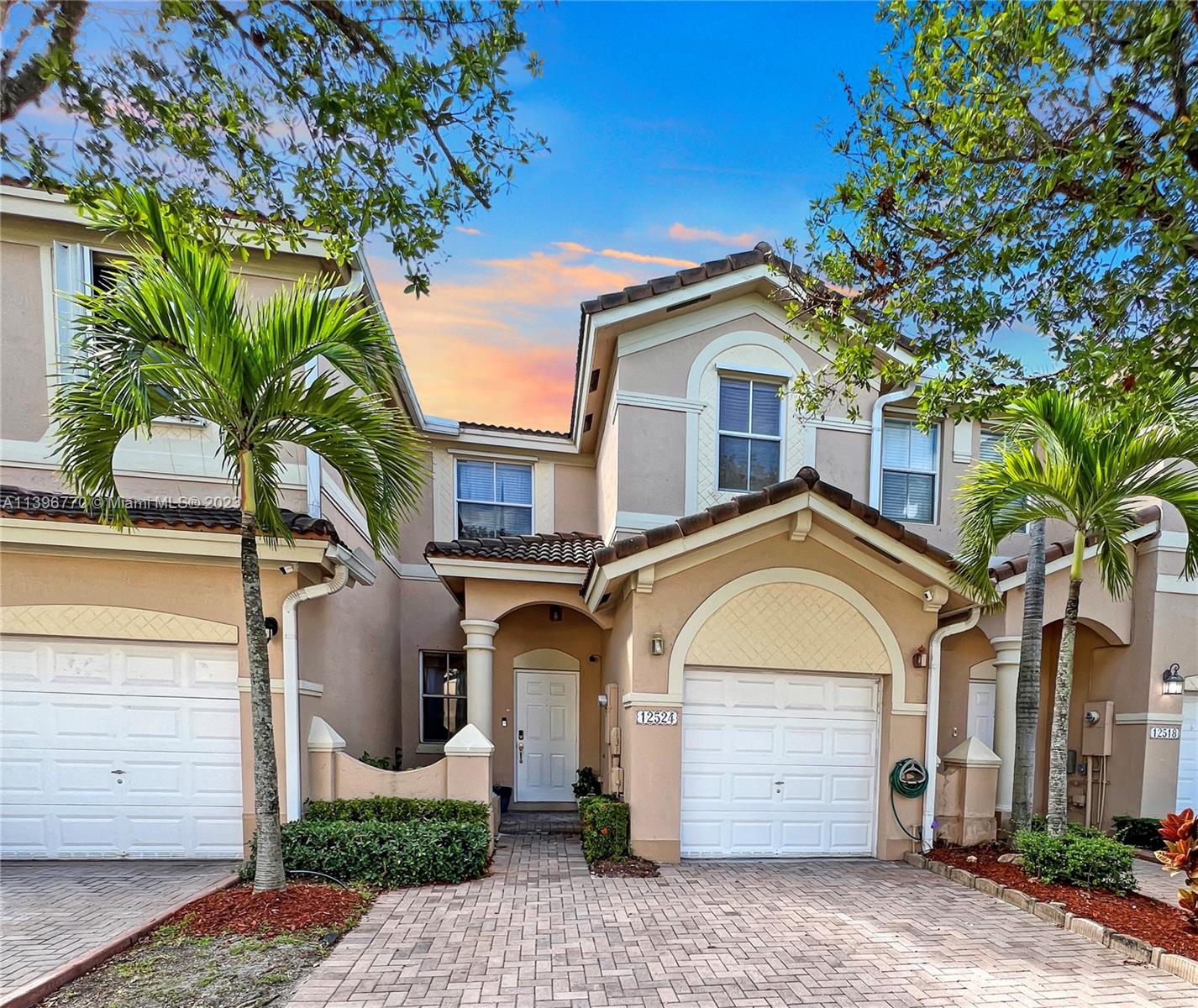 12524 Southwest 126th Avenue Miami, FL 33186 - Photo 2 of 23 a front view of a house with a tree