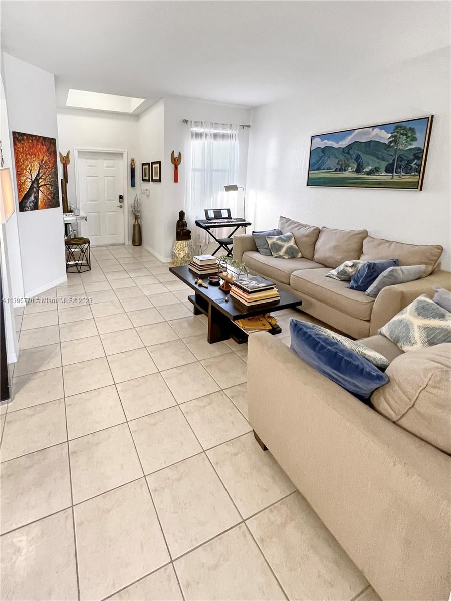 12524 Southwest 126th Avenue Miami, FL 33186 - Photo 6 of 23 a living room with furniture and a couch