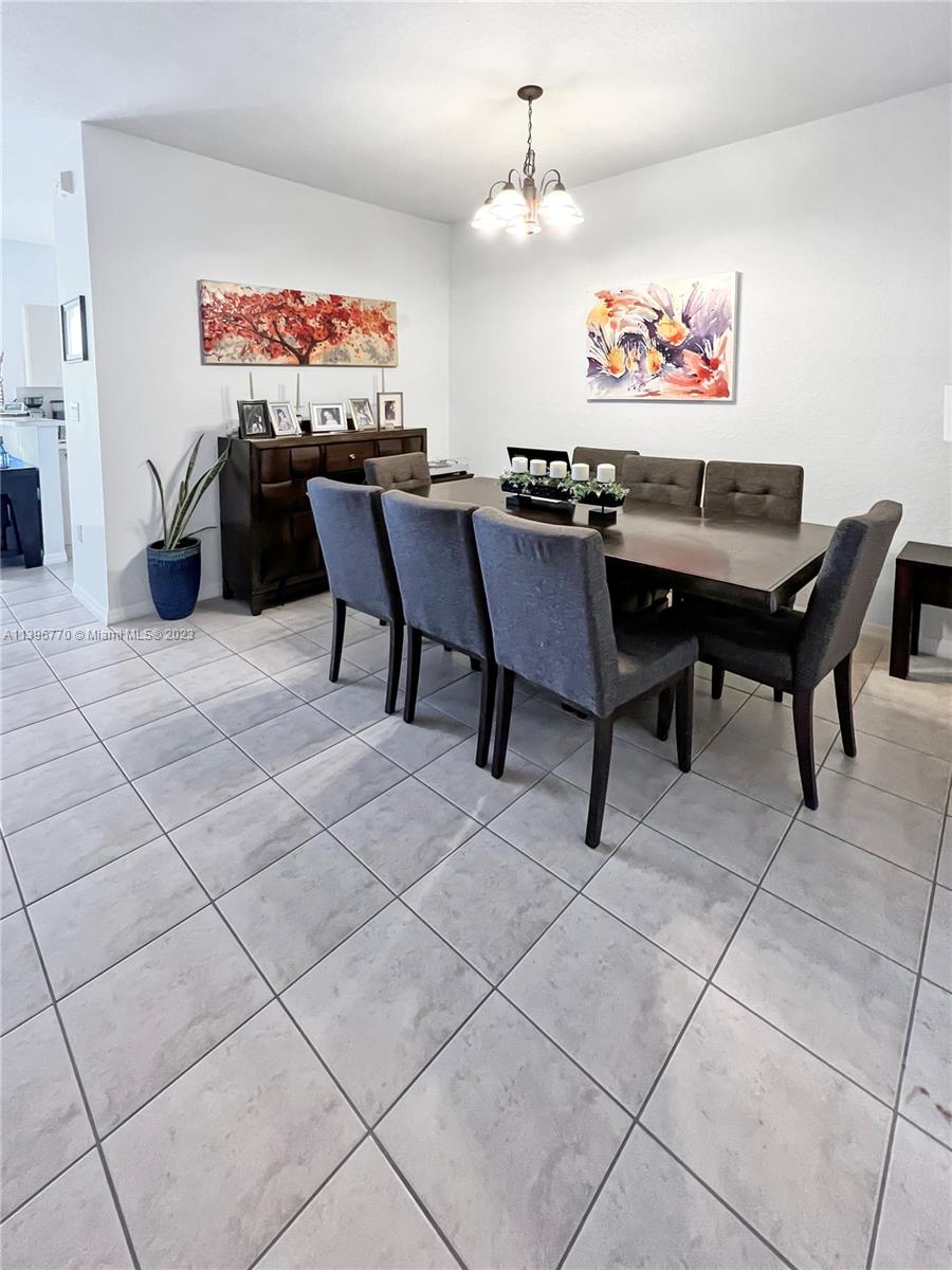 12524 Southwest 126th Avenue Miami, FL 33186 - Photo 7 of 23 a view of a dining room with furniture