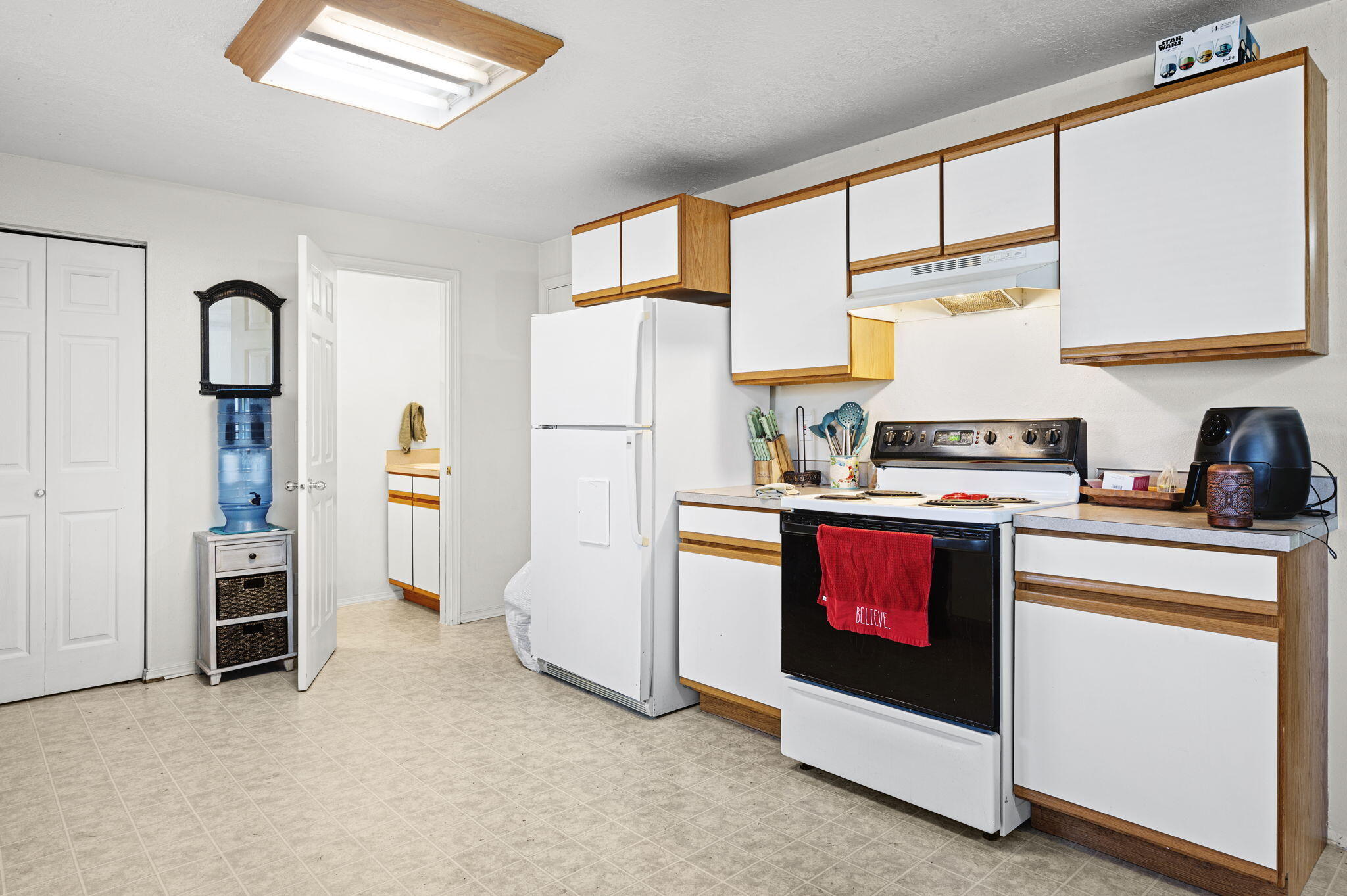 937 Northwest Cains Road, Unit A Prineville, OR 97754 - Photo 12 of 24 a kitchen with refrigerator and cabinets