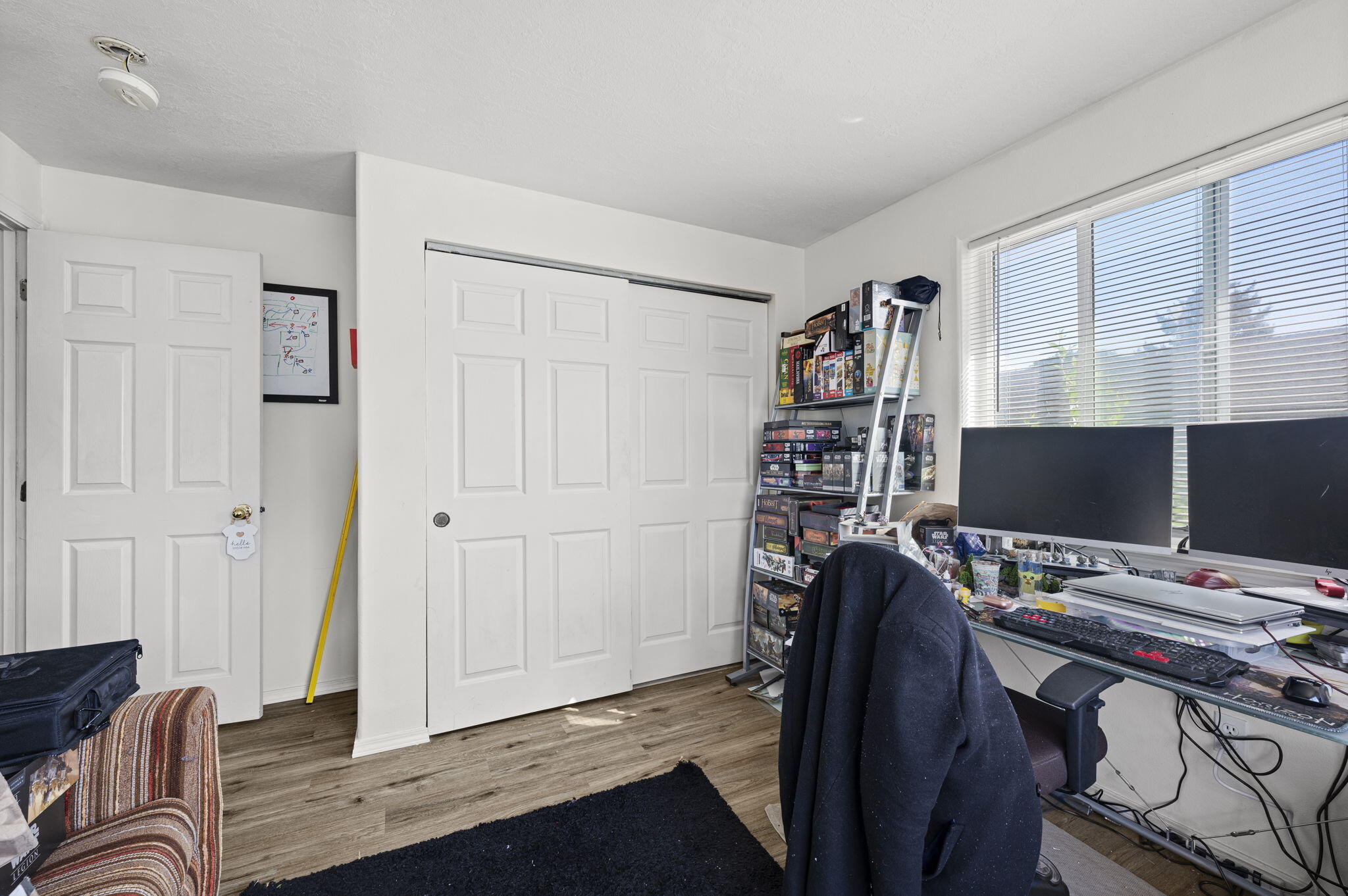 937 Northwest Cains Road, Unit A Prineville, OR 97754 - Photo 19 of 24 a view of a workspace with furniture and clothes