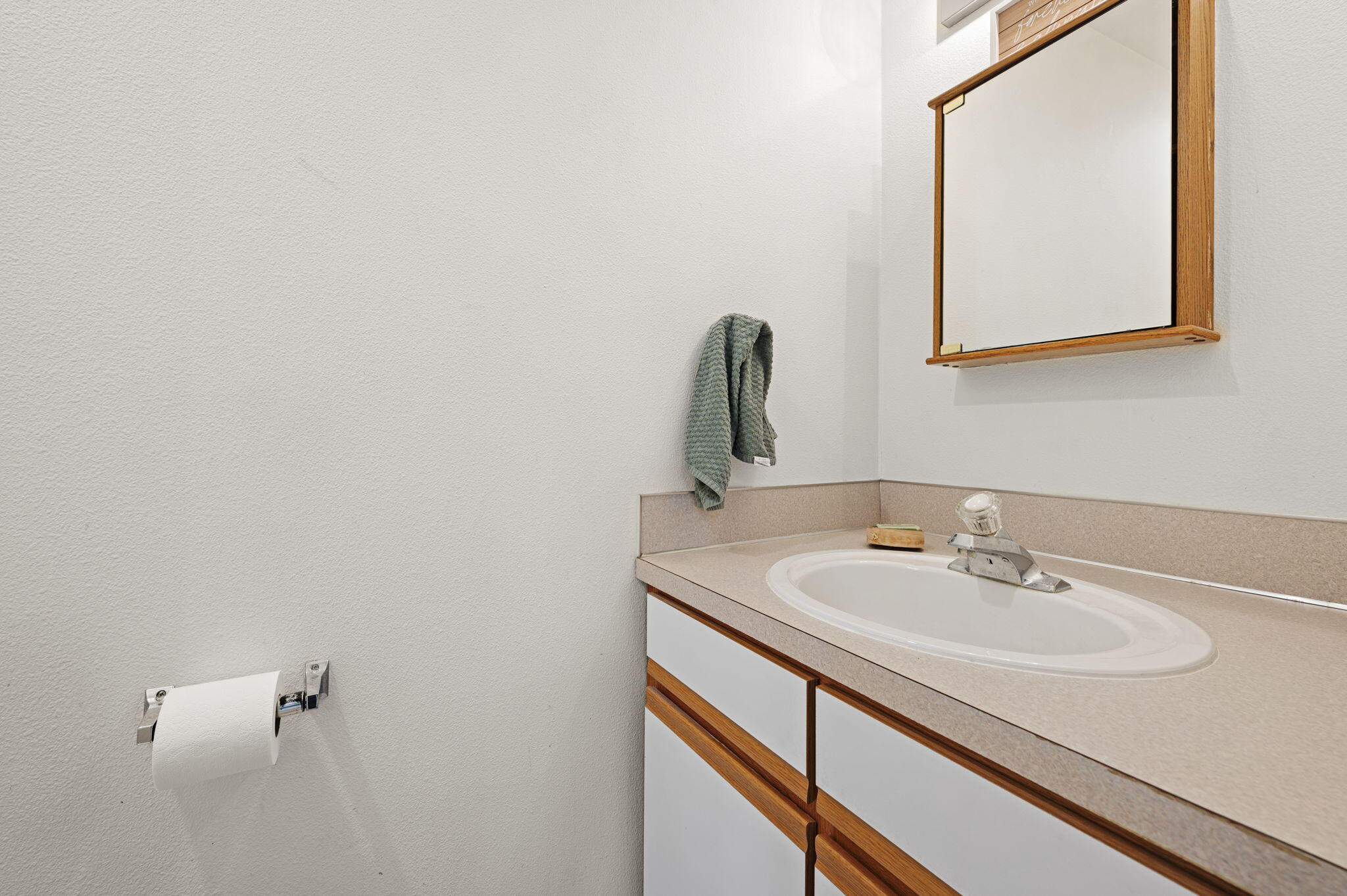 937 Northwest Cains Road, Unit A Prineville, OR 97754 - Photo 20 of 24 a bathroom with a sink and a mirror