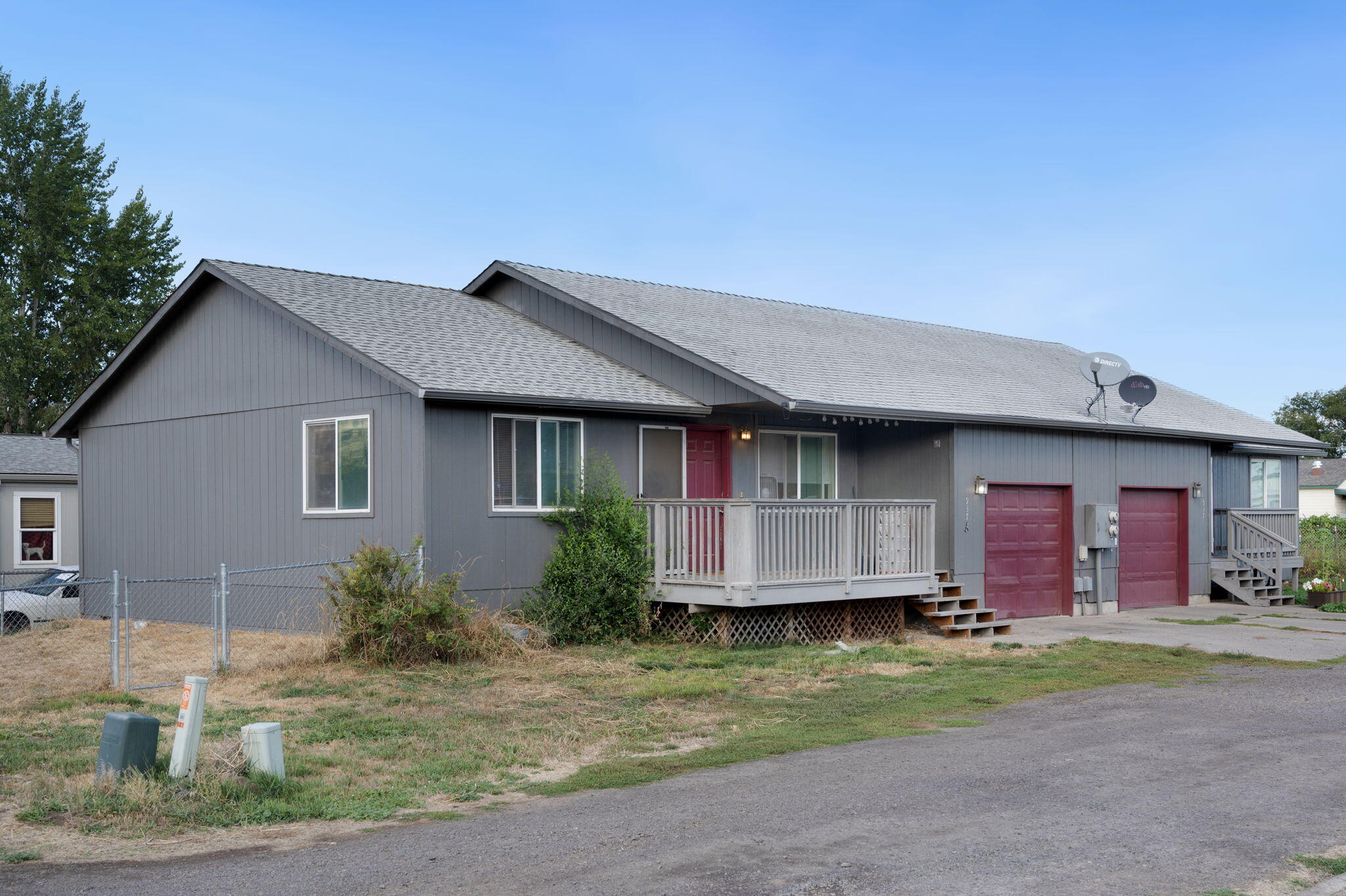 937 Northwest Cains Road, Unit A Prineville, OR 97754 - Photo 2 of 24 a front view of a house with a garden