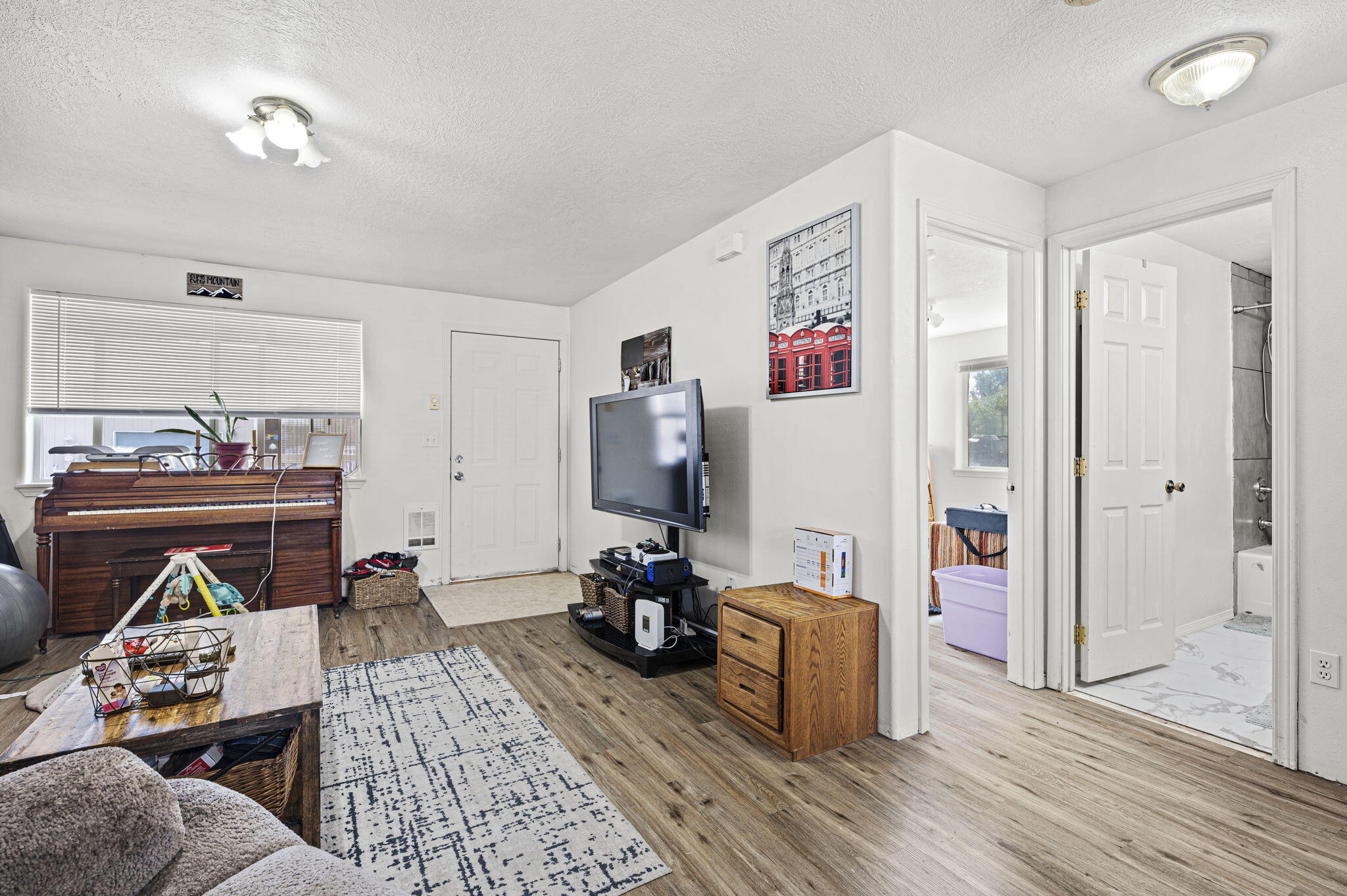 937 Northwest Cains Road, Unit A Prineville, OR 97754 - Photo 7 of 24 a living room with furniture and a wooden floor