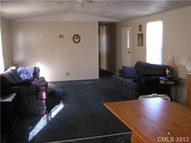 294 Russell Road Polkton, NC 28135 - Photo 6 of 16 a living room with furniture and wooden floor