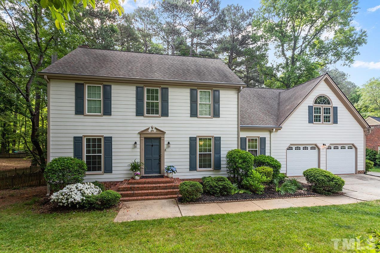 8408 Morgans Way Raleigh, NC 27613 - Photo 1 of 34 a aerial view of a house with a yard and plants