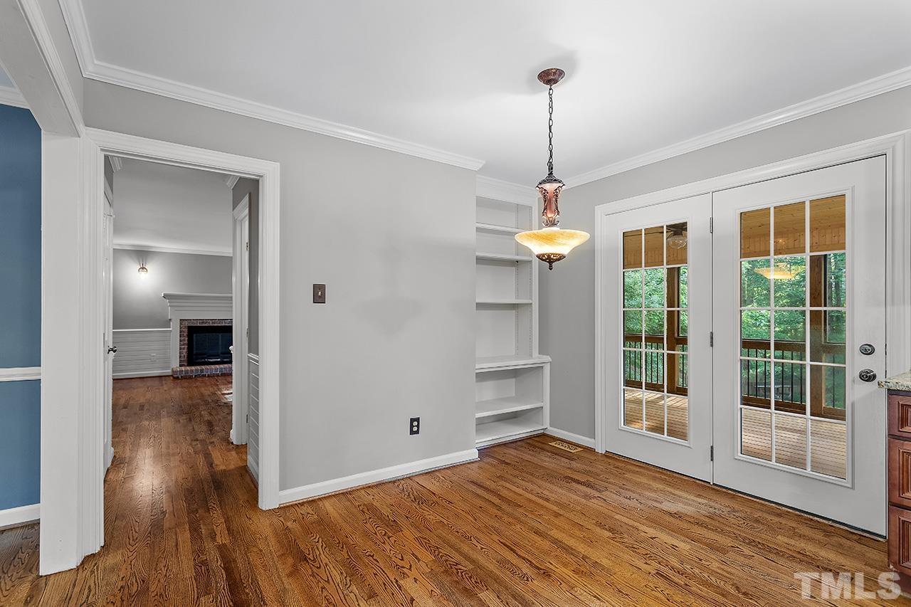 8408 Morgans Way Raleigh, NC 27613 - Photo 12 of 34 a view of empty room with wooden floor and fan