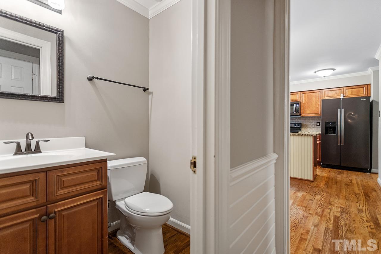 8408 Morgans Way Raleigh, NC 27613 - Photo 16 of 34 a bathroom with a toilet sink and shower