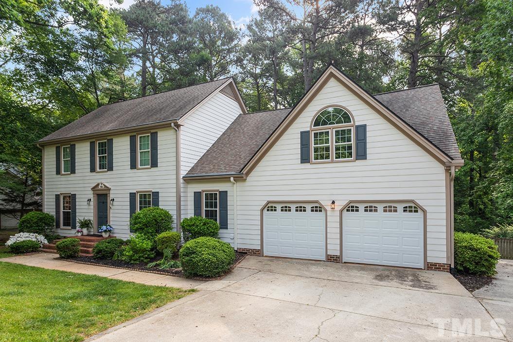 8408 Morgans Way Raleigh, NC 27613 - Photo 2 of 34 a view of a house with a yard plants and large tree
